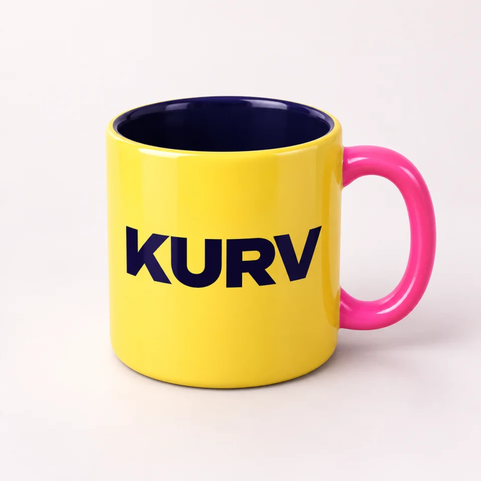 Yellow KURV mug concept with navy wordmark and pink handle
